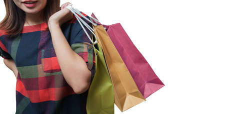Shopping close up asian woman holding bags, isolated on white background, Copy space with clipping path.の写真素材