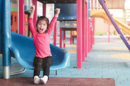 back to school concept, Young asian cute girl or pupil happy at playground in first day of...