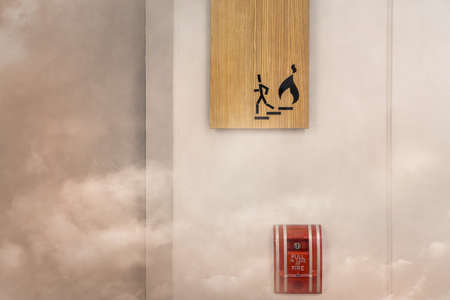 Fire alarm near door fire exit  in fire situationの写真素材