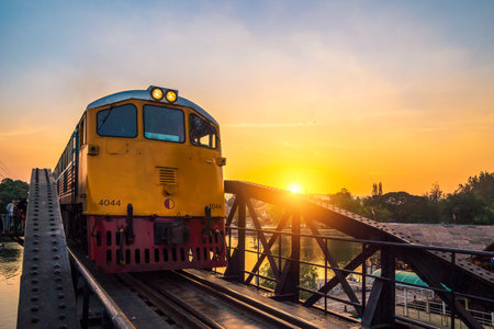 December 27 2018, Kanchanaburi, Thailand : The train on the bridge of River Kwai at sunset time, Landmark of the second world war.のeditorial素材