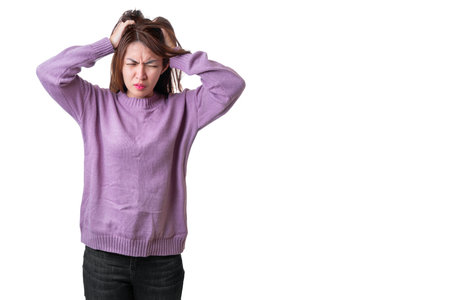 Asian woman wear white t-shirt  hearing loss or hard of hearing and  cupping her hand behind her ear isolate on white background , Deaf concept.の写真素材