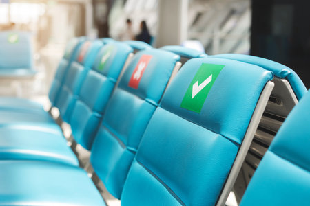 Seat on empty with X symbol sticker at airport , social distancing for protect coronavirus or covid-19 virus a new normal trend.の写真素材