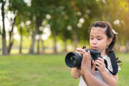 Happy cheerful caucasian mixed race girl smiling at outdoors park.