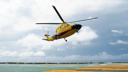 The helicopter landing on at oil platformの写真素材