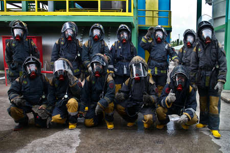 Rayong province, Thailand ,October 04, 2019 :Group picture of firefighters with oxygen tank on their backs. Portrait of firefighters team in uniform ,firemanのeditorial素材