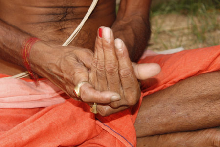 Buddhist monk holding hands in the temple.の写真素材