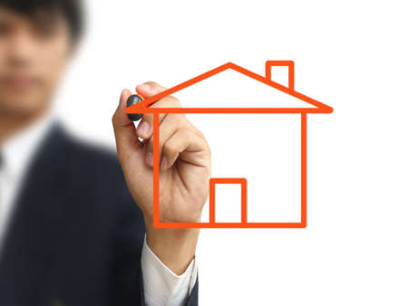 Businessman write homeの写真素材