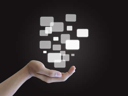 Hand holding touch screen interfaceの写真素材