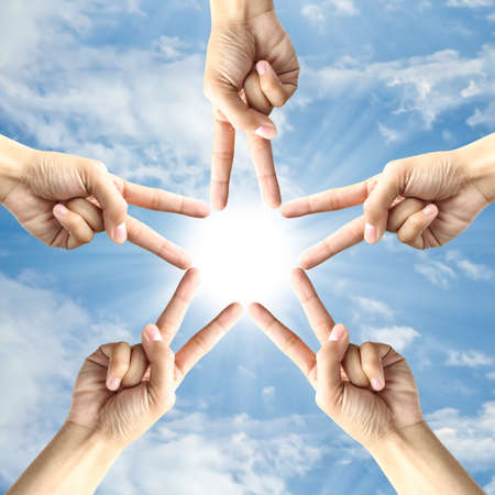 Hand make frame around the sunの写真素材