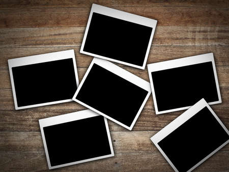 Photo frame on wood wallの写真素材
