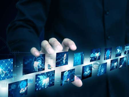businessman holding technology