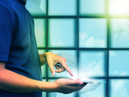 Man press smart phoneの写真素材