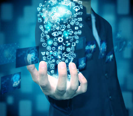 businessman holding icons