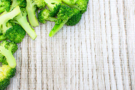 Fresh broccoli on white wooden backgroundの写真素材