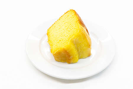 Closeup piece of sweet lemon cake served on white plateの写真素材