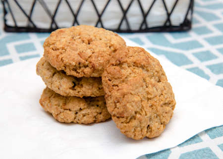 Stack of freshly baked oatmeal cookies on a paper napkinの写真素材