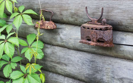 the old iron for an ironing hanging on a wallの写真素材