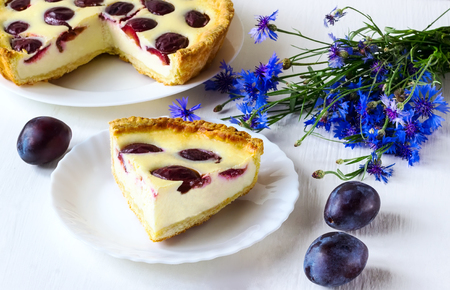 plums pie on a white plateの写真素材