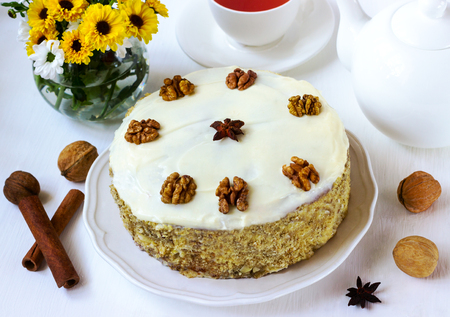 pie with carrots walnuts spices on a white backgroundの写真素材