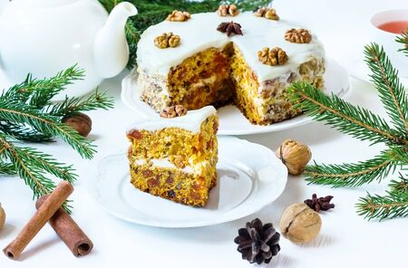 pie with carrots walnuts spices on a white backgroundの写真素材