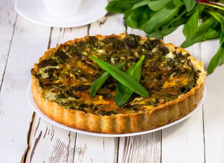 pie with a ramson on a white wooden backgroundの写真素材