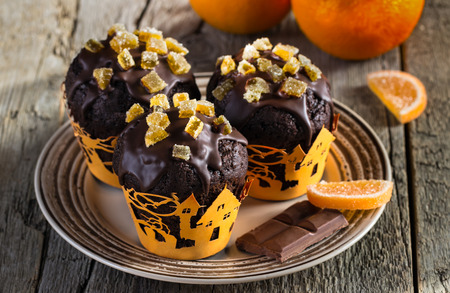 chocolate muffins with candied fruitsの写真素材