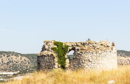 old wall of fortress against the blue skyの写真素材