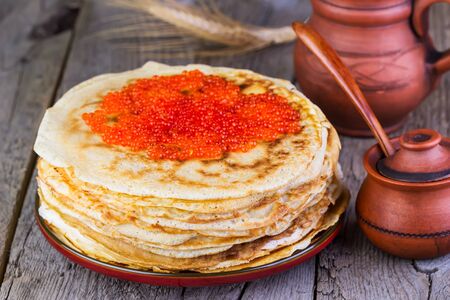 pancakes with red caviar on a wooden backgroundの写真素材