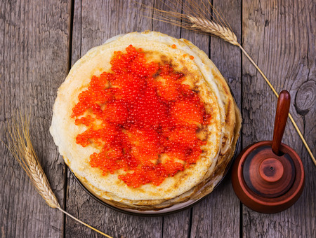 pancakes with red caviar on a wooden backgroundの写真素材