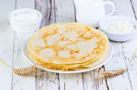 pancakes on a white wooden backgroundの写真素材