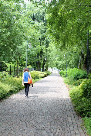July 28, 2016, Padua, Northern Italy. Woman walking in Gardens of Arena. Popular touristic european destination. Padua city viewのeditorial素材