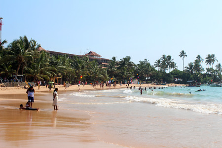 December 25, 2017, tourists and local people at Hikkaduwa Beach in Hikkaduwa, Sri Lanka. Popular touristic asian destination. Seascape. Landscape. Vacationのeditorial素材