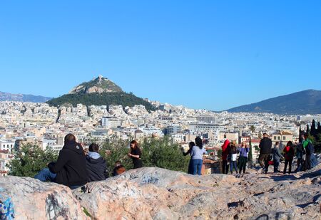 December 23, 2018, Athens, Attica, Greece. Many tourists relaxing and watching city view of Athens and Lycabettus Mount. Popular touristic european destinationのeditorial素材