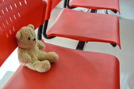 Teddy Bear On red chairの写真素材