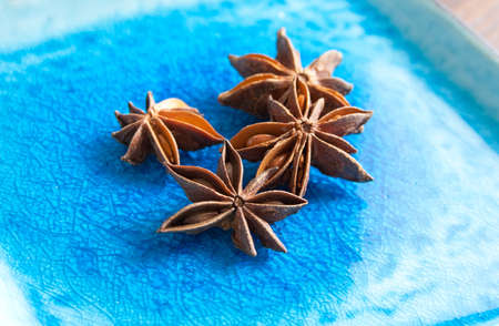 Star Anise on a Blue Ceramic Plateの写真素材