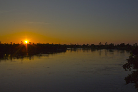 Sunset over riverの写真素材