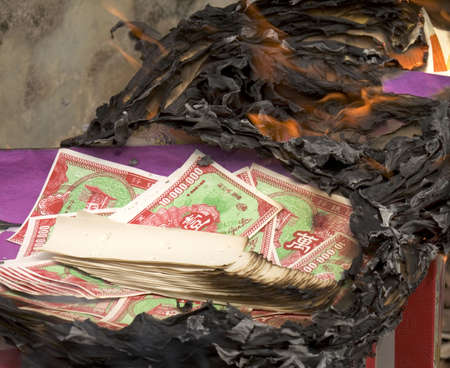 Burning hell money at Qing Ming Festival, Malaysiaの写真素材