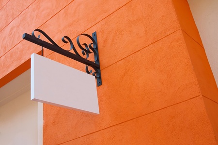 blank white sign board on the wallの写真素材