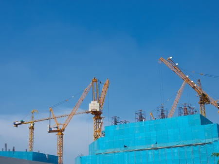 building under construction with blue sky in backgroundの写真素材