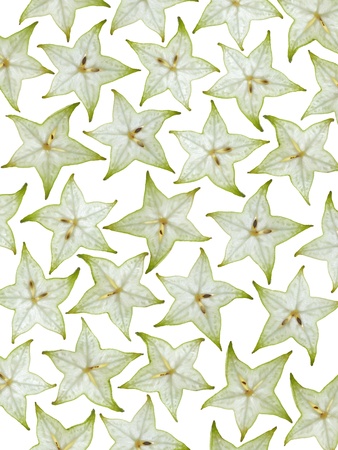 sliced green star fruit isolated on white backgroundの写真素材