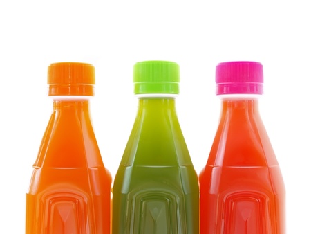 colorful juice in bottle isolate over white background の写真素材