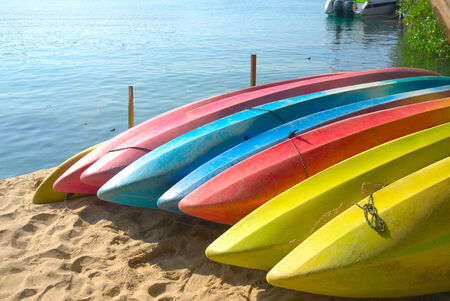 Row of Kayaks beside the seaの写真素材