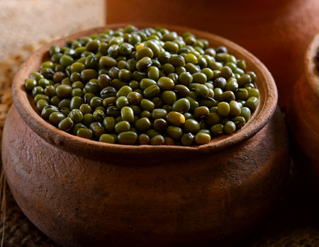 Green beans in clay potの写真素材