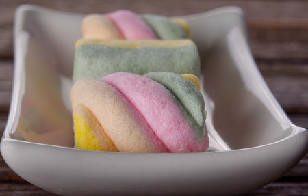 marshmallows on woodの写真素材