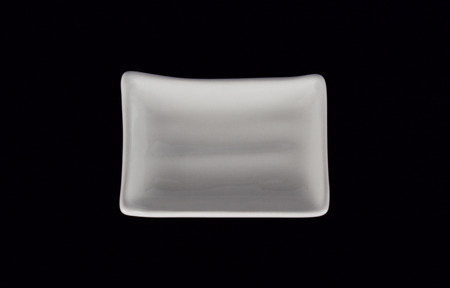 A cup of sauce on blackの写真素材