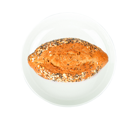 Breadcorn in white plate on white background