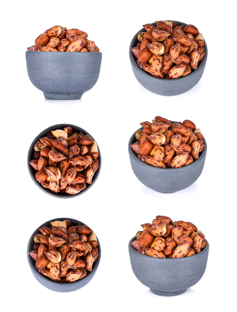 Nuts in bowl isolated on white backgroundの写真素材