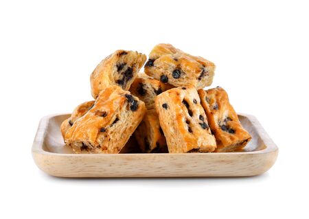 Chocolate chip stick In a wooden plate on white backgroundの写真素材