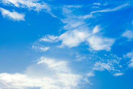 The blue sky is full of fluffy clouds.
