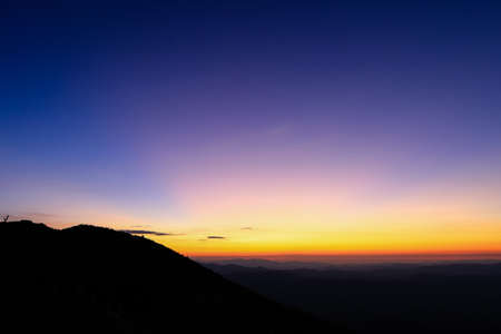 colorful sky above mountain just before sunriseの写真素材